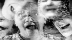 Multiple faces in nightmare sequence in The Last Laugh Multiple faces in nightmare sequence in The Last Laugh