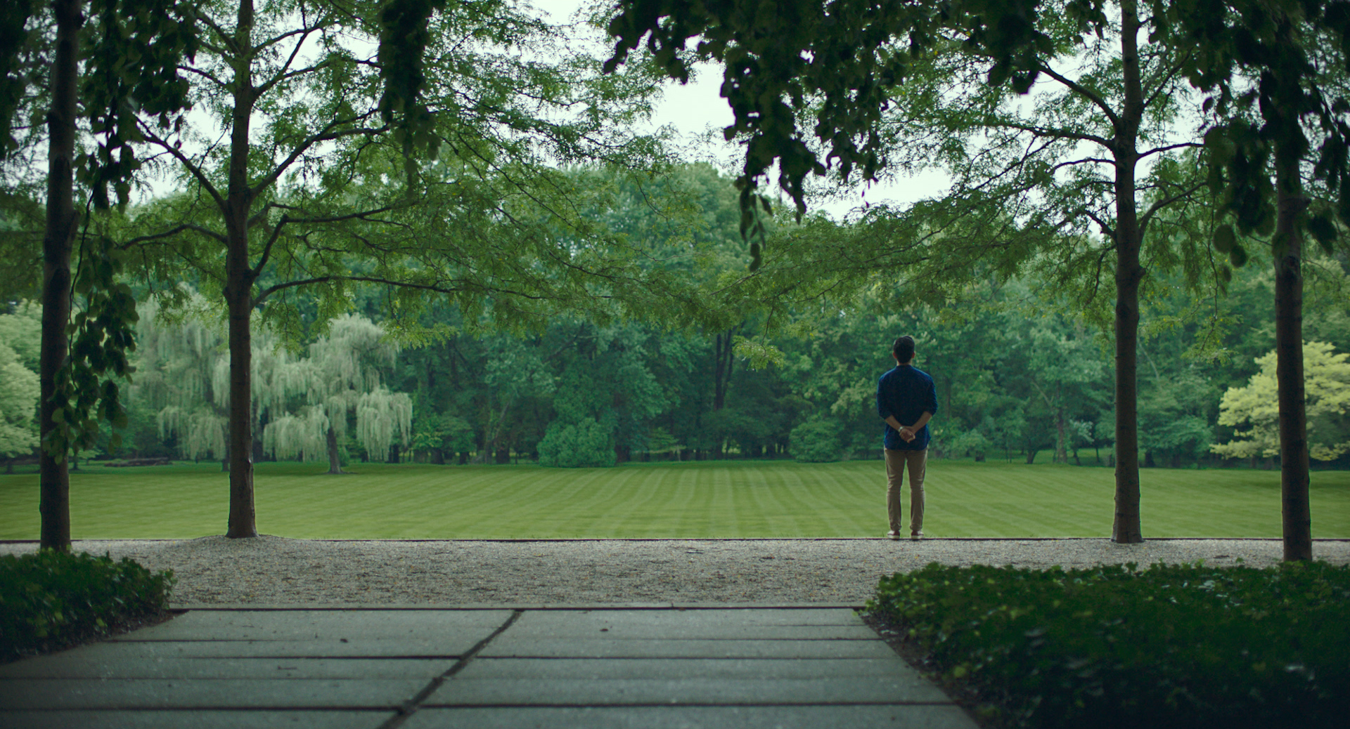 John Cho looking at landscape in Columbus