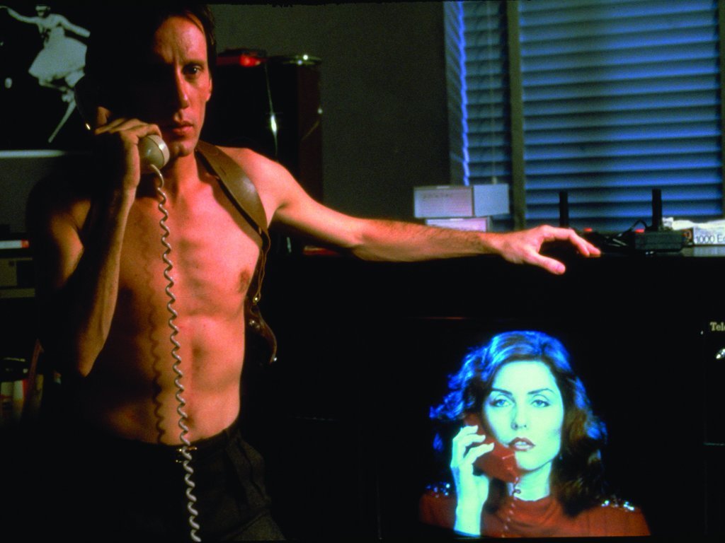 James Woods and Debbie Harry on phones in Videodrome