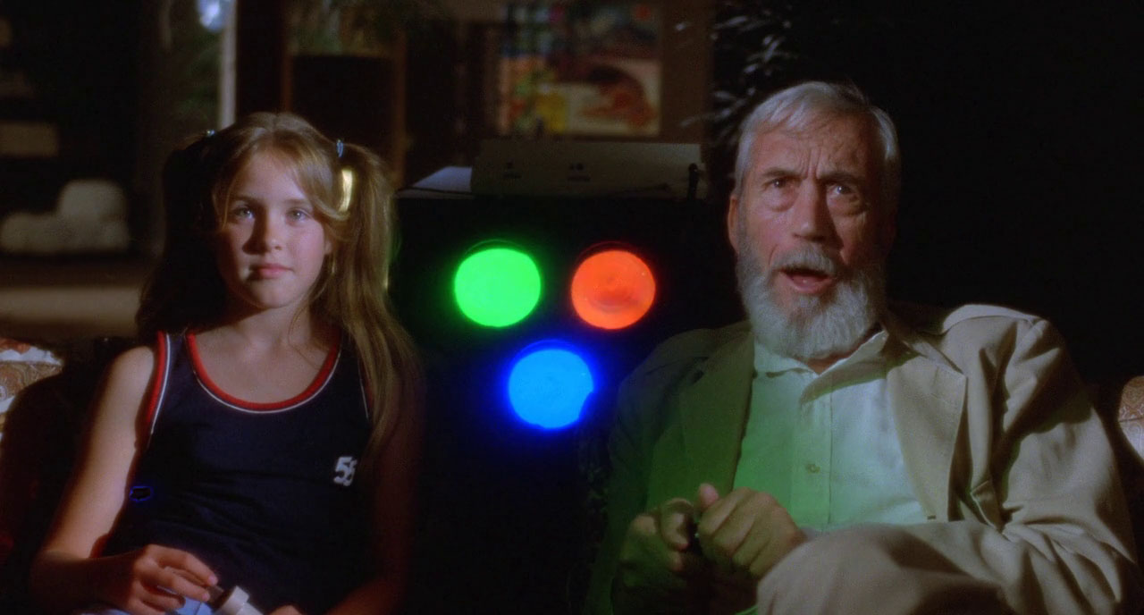 Paige Conner and John Huston in The Visitor