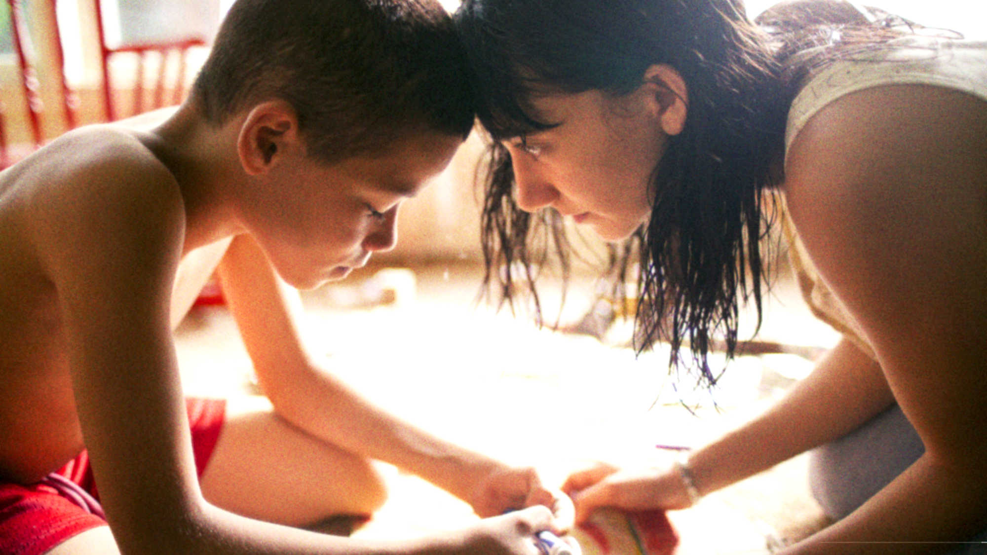 Sheila Vand and Evan Rosado in We The Animals